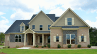An image of a house listed for sale, with the owner looking up the cost to sell a home in Michigan.